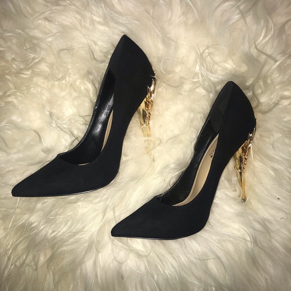 black heels with gold heel